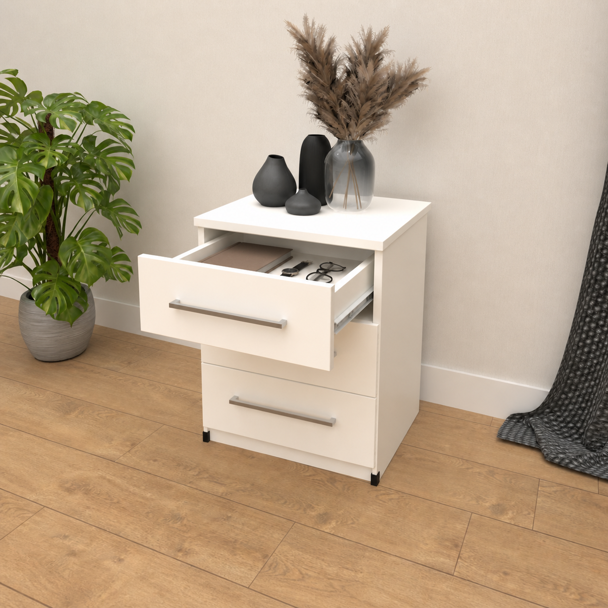 Inside of 3 drawer bedside table for compact bedroom storage